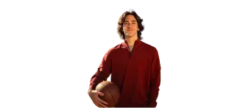 Teenaged male hemophilia patient holding a basketball